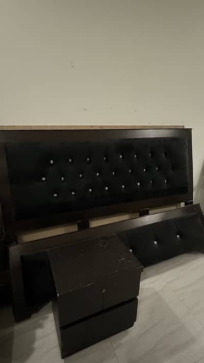 Queen sized bed black brown
