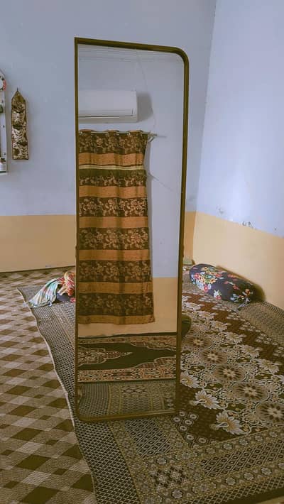 gold frame stand mirror with stole
