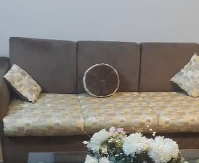 sofa set with round table and curtains