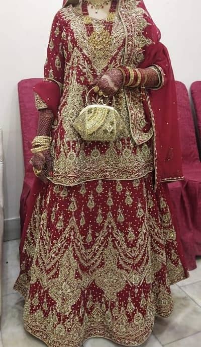 bridal lehenga /barat Drees in Deep Red & heavy gold Embroidery