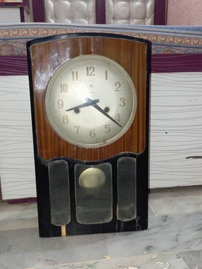 antique pendolum wall clock