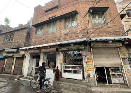 Commercial property with 9 Shops and full 3 story Cornerhouse