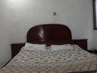 one wood duble bed and one dressing