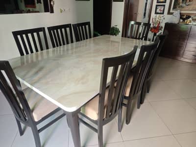 Dinning table with marble look top and 8dark brown polished wooden cha