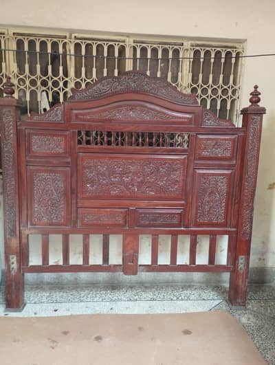 Wooden bed with mattress and dressing table