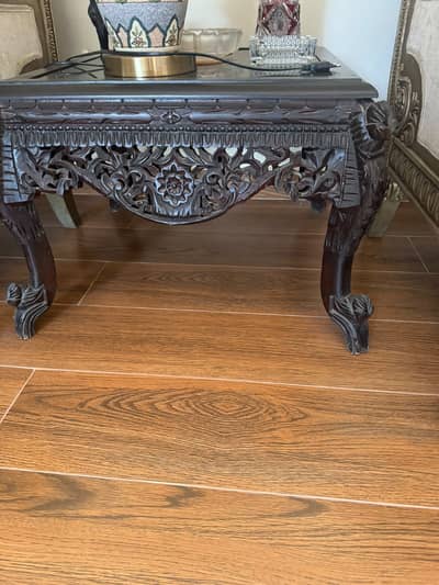 Elegant Carved Wooden Coffee Table with Glass Top