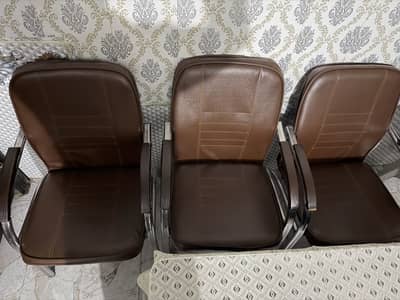 Three chairs and two tables for office and home use