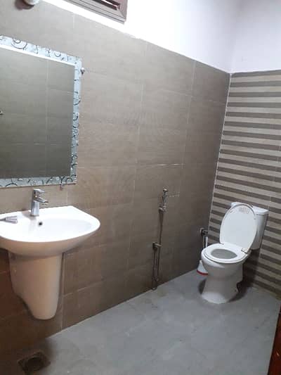 three bed dd tiled flooring portion for rent in johar