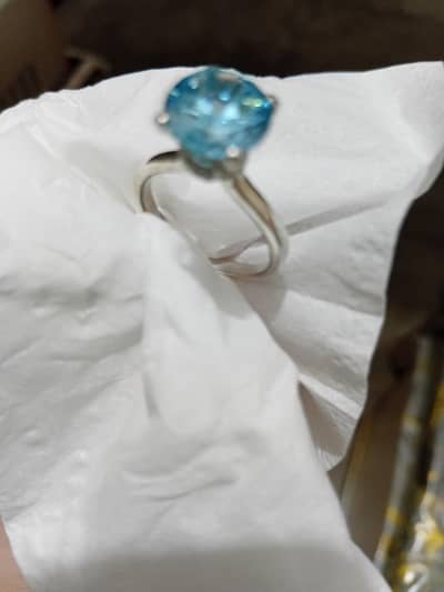 its pure chandi ring  ,4 gram ring  with imported aquamarine stone