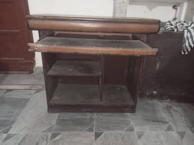 solid-wood study/office table or writing desk with storage and chair.