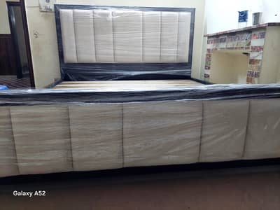double bed alingwith two side table one dressing with big mirror