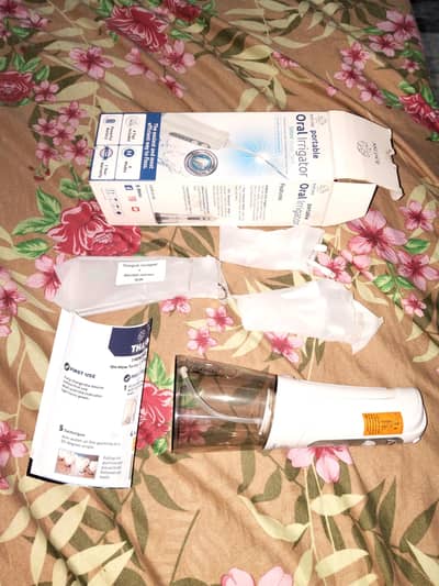 portable oral irrigator