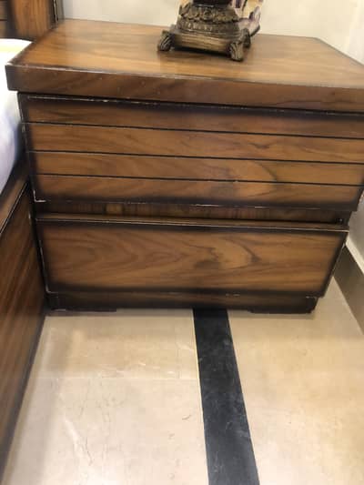 Double king size bed with side table and dressing table
