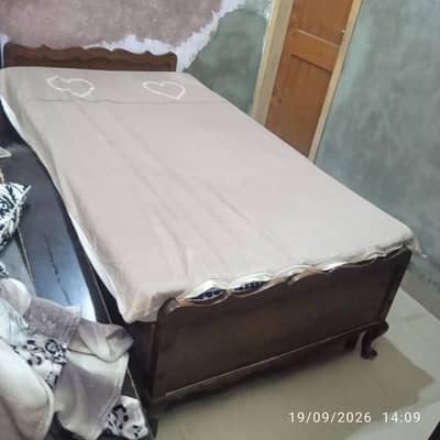 single wooden bed in good condition without mattress