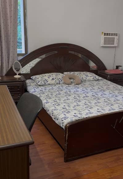 Queen size wooden bed with side tables