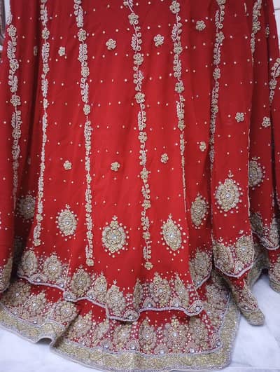 Bridal nikah red lehenga with golden handwork