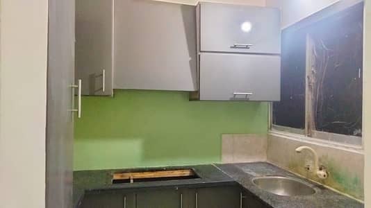 Renovated 2 bed lounge 2nd floor flate for rent tiled flooring America kitchen tiled washrooms 24 hours water and electricity