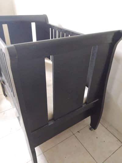 Wooden baby cot storage drawer