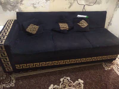 L shape sofa in brigh black colour is for sale