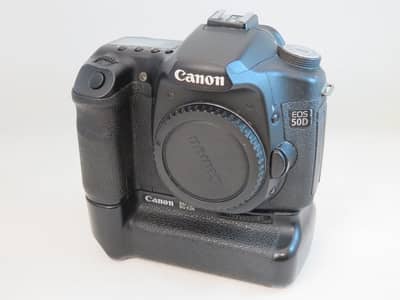 "Canon 50D Professional Setup with Battery Grip and Portrait Lens"