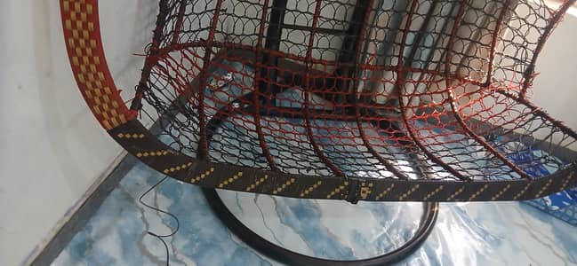 A hanging egg swing chair (or jhoola