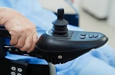 Electronic wheelchair joystick controllers