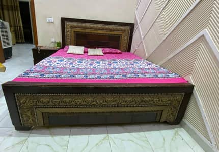 bed with 2 side tables without mattress in used condition