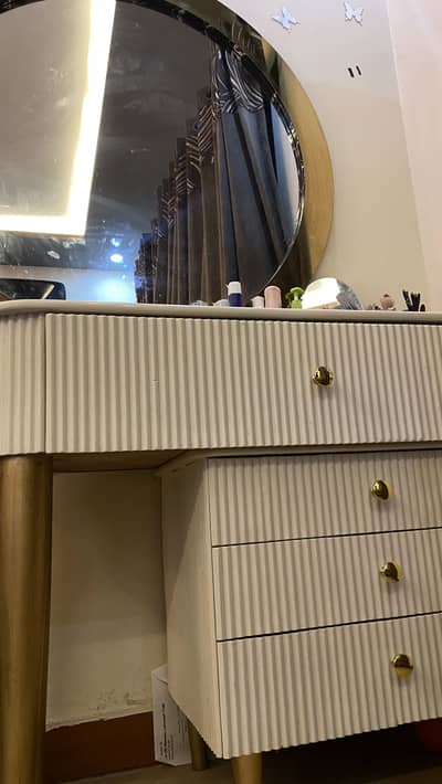 White color dressing table with big size round gold mirror