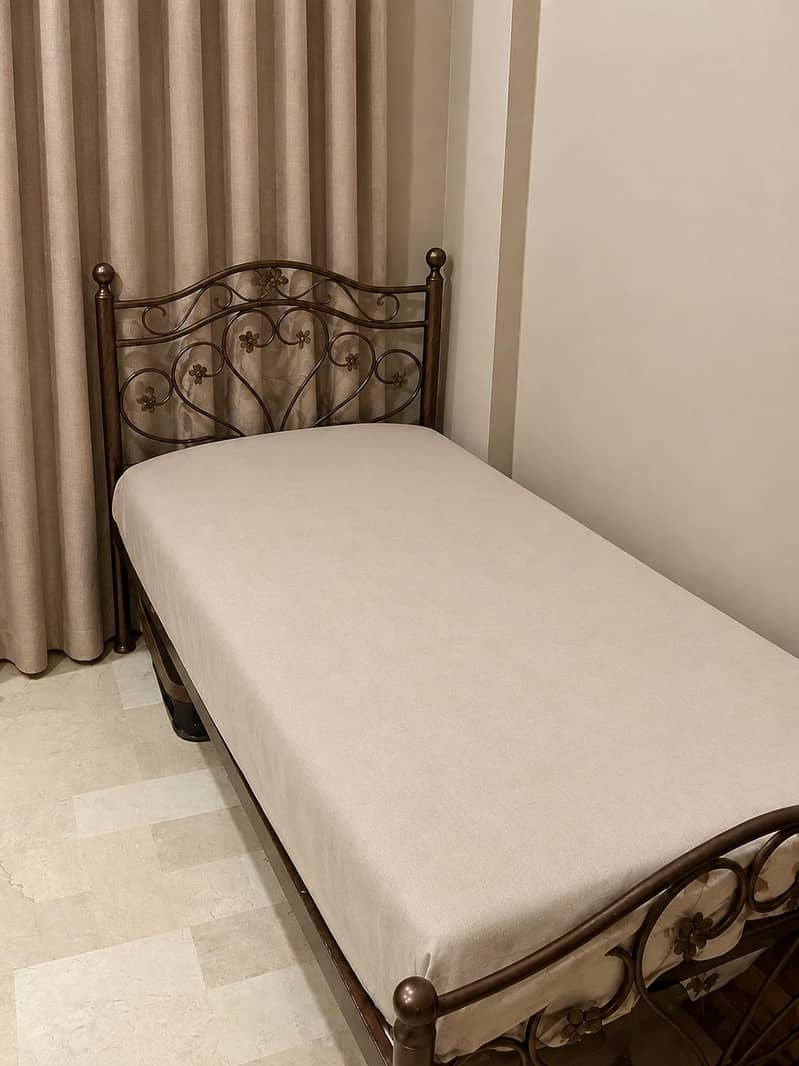 single iron bed. . 0