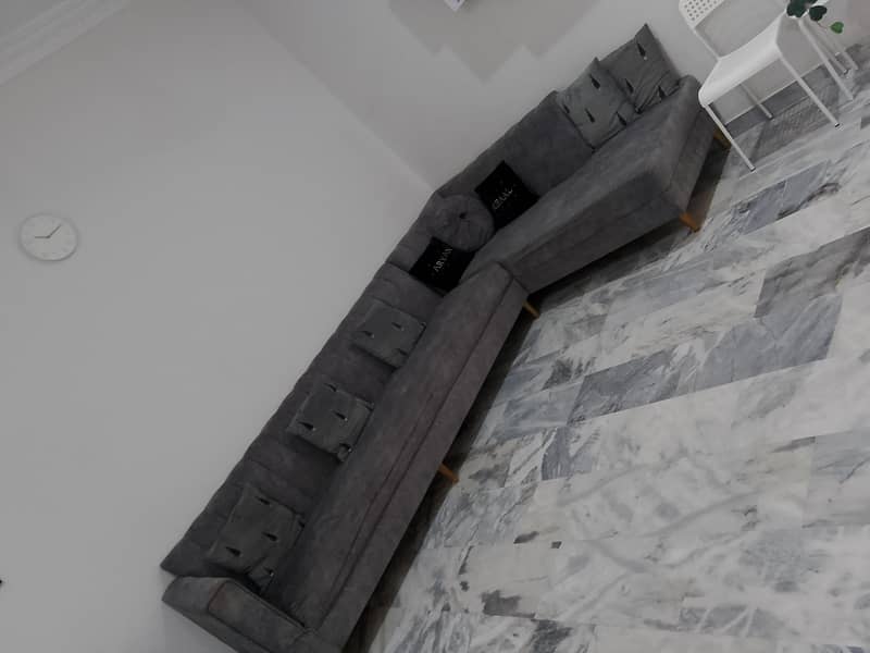L shape gray soffa set on 2
