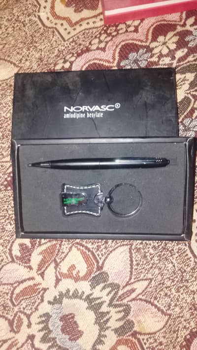 1 pen and 1 keychain
