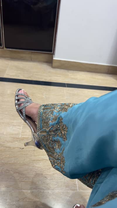Its silver 38 size with 2 inch heel