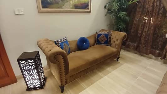 A new, neat and clean sofa is available for sale.
