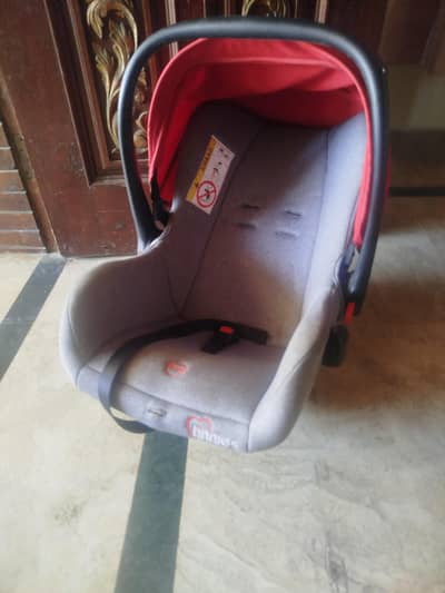 Toddlers car seat. Carry Cot