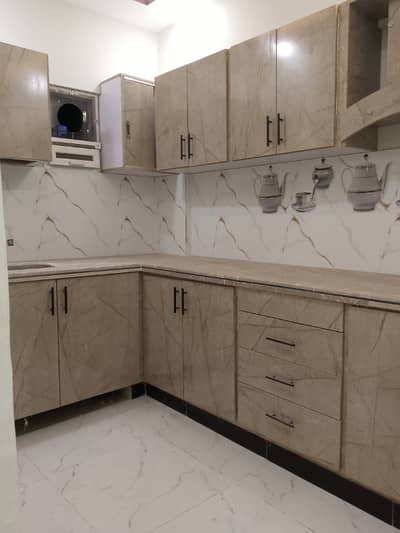 Brand New 2 bed drawing lounge 2nd floor maymar plaza flate for rent tiled flooring America kitchen tiled washrooms 24 hours water and electricity