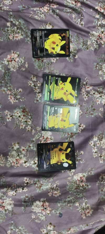 4 black Pokemon cardsbes