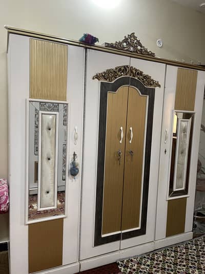 Bed, side tables, cupboard, divider, dressing table