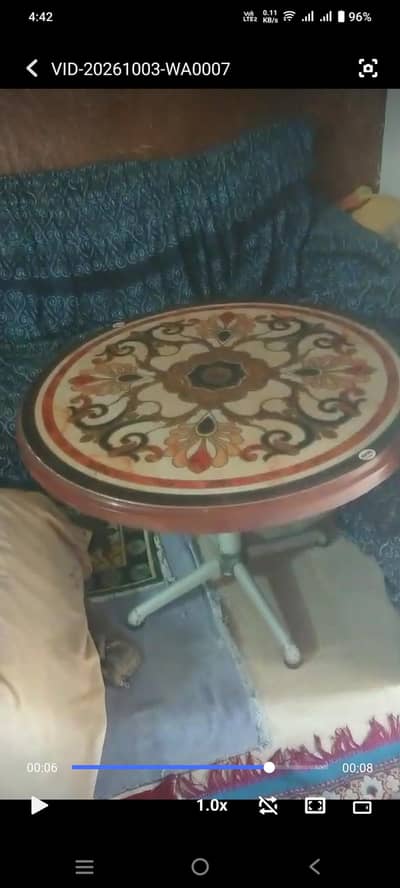 coffe table with 3 plastis chairs