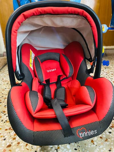 Tinnies Car Seat (also serves as a carry cot)