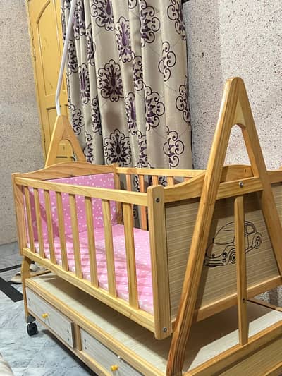 Baby cot with swing and drawers
