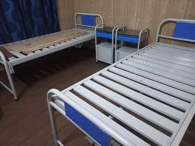Hospital beds with side tables