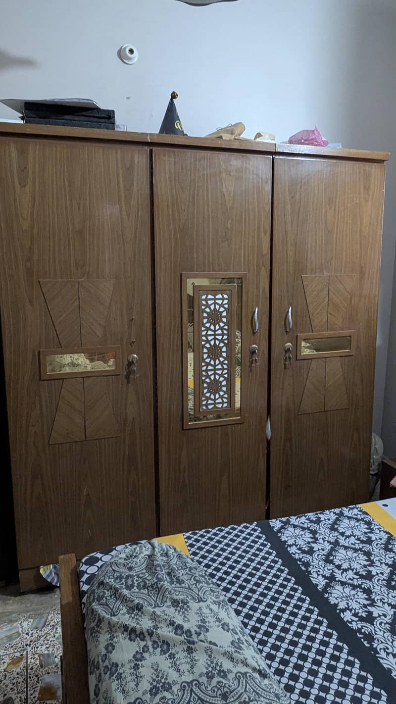 complete bedset with bed, wardrobe, dressing, side table & cupboard. 5