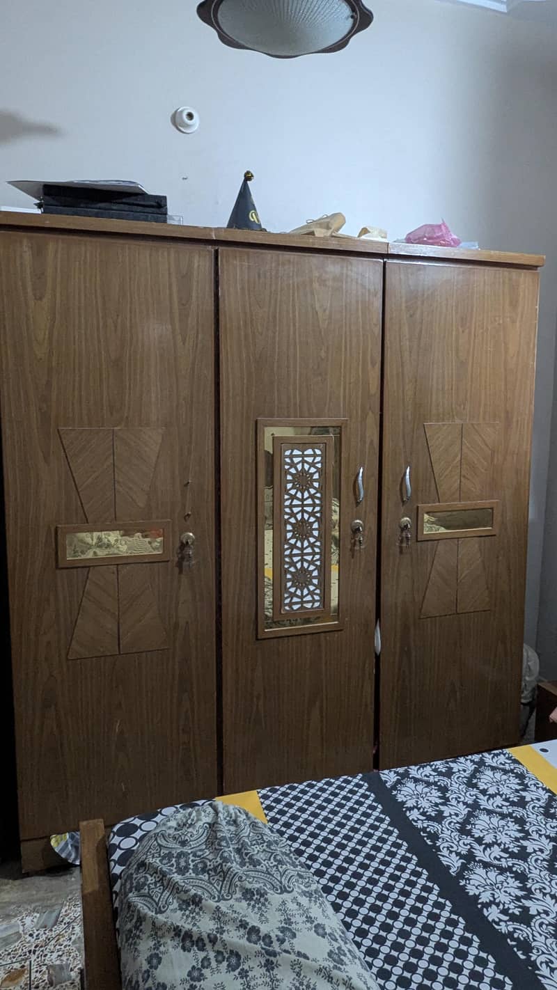 complete bedset with bed, wardrobe, dressing, side table & cupboard. 6