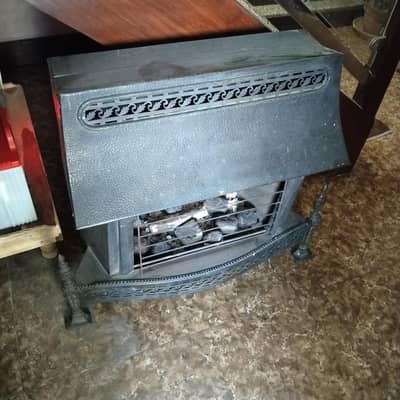 gas heater in a good condition with artificial coal and log