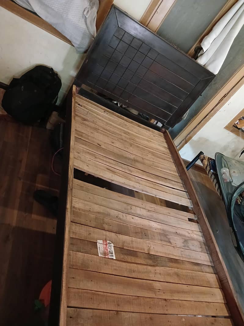 Single wodden bed. 3