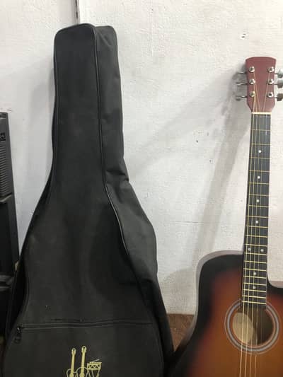 Beginners guitar with bag and capo