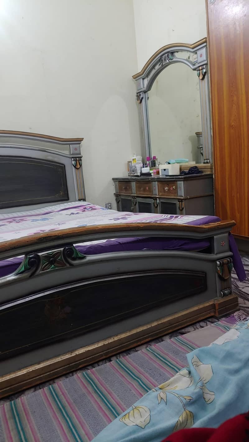 1 double bed without matress 2 side table 1 dressing table 1