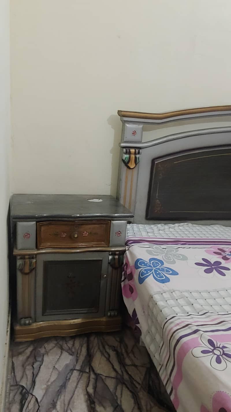 1 double bed without matress 2 side table 1 dressing table 4