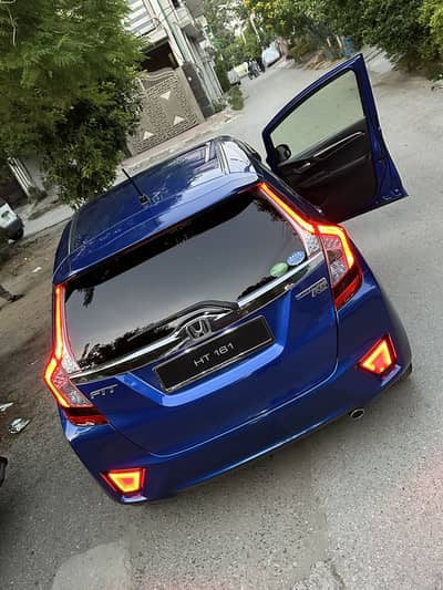 Honda Fit Approx Total geniune giving 26km / L fuel avg