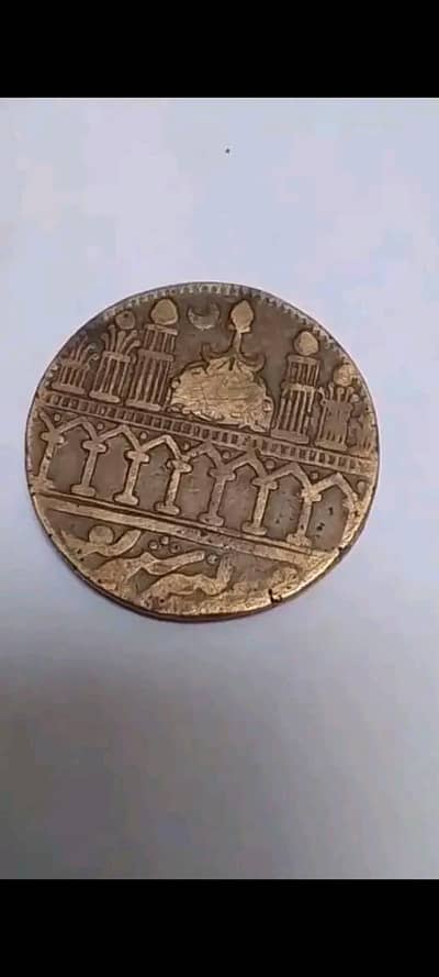 original antique this is not tokken. this makes bay hand see this coin